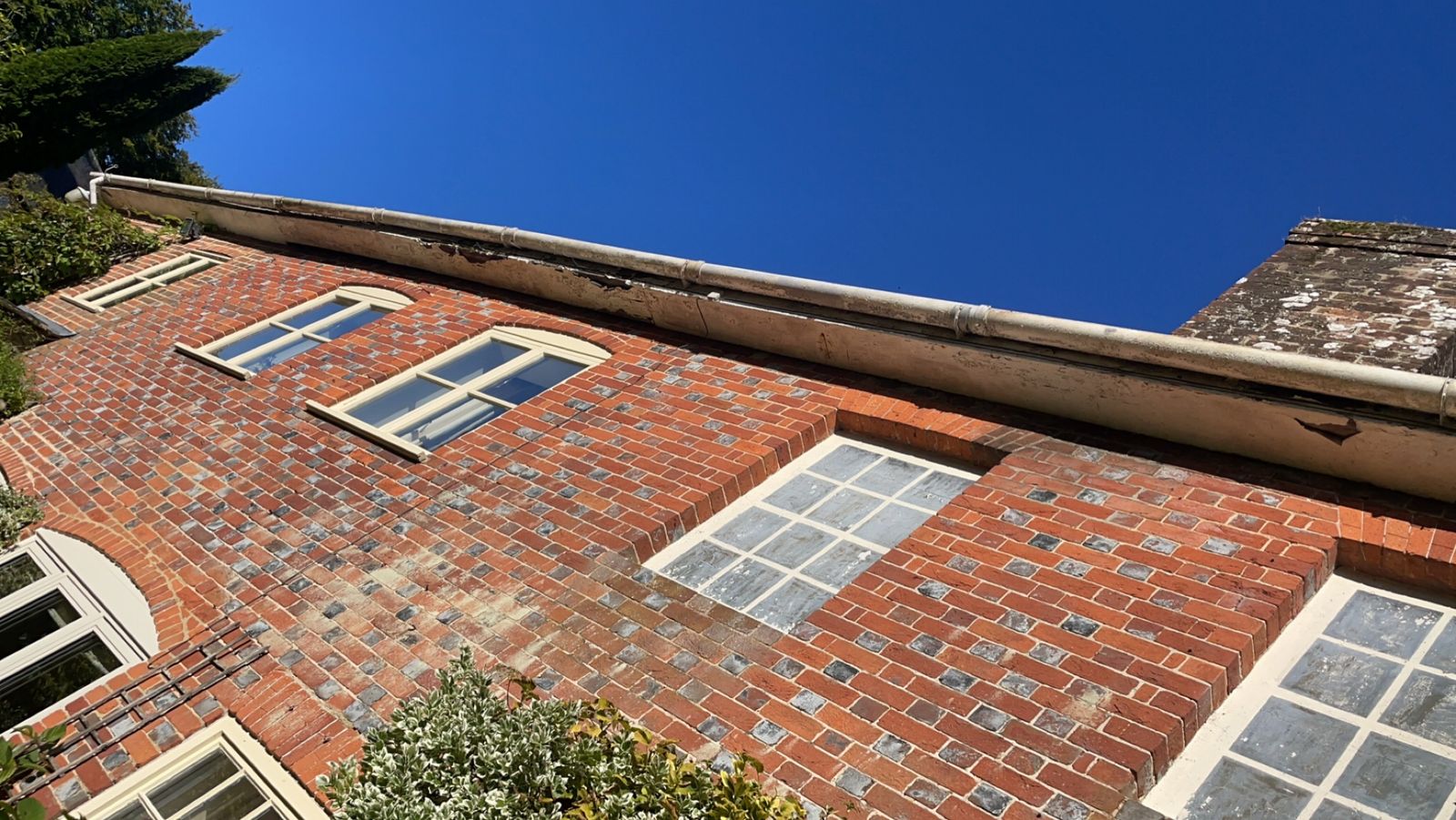 Period house before: old painted timber fascia and plastic gutter